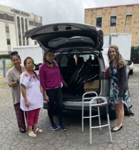 Medical Missionaries providing a wheel chair for a student.